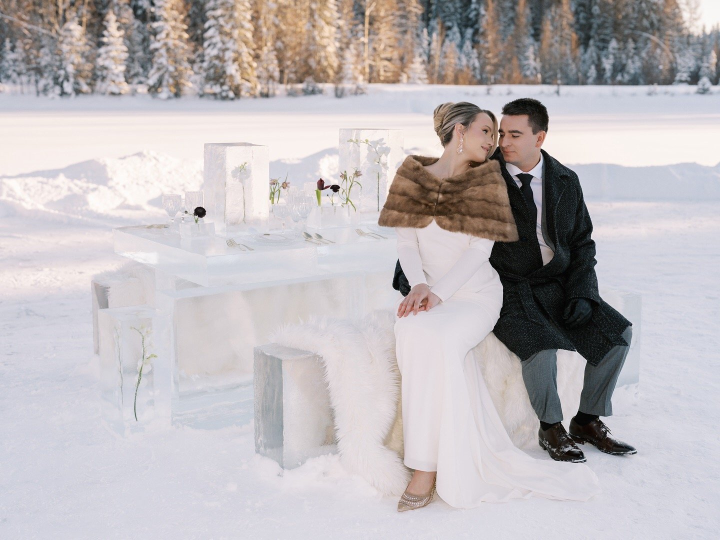 Couple kissing beside the ice table at golden hour