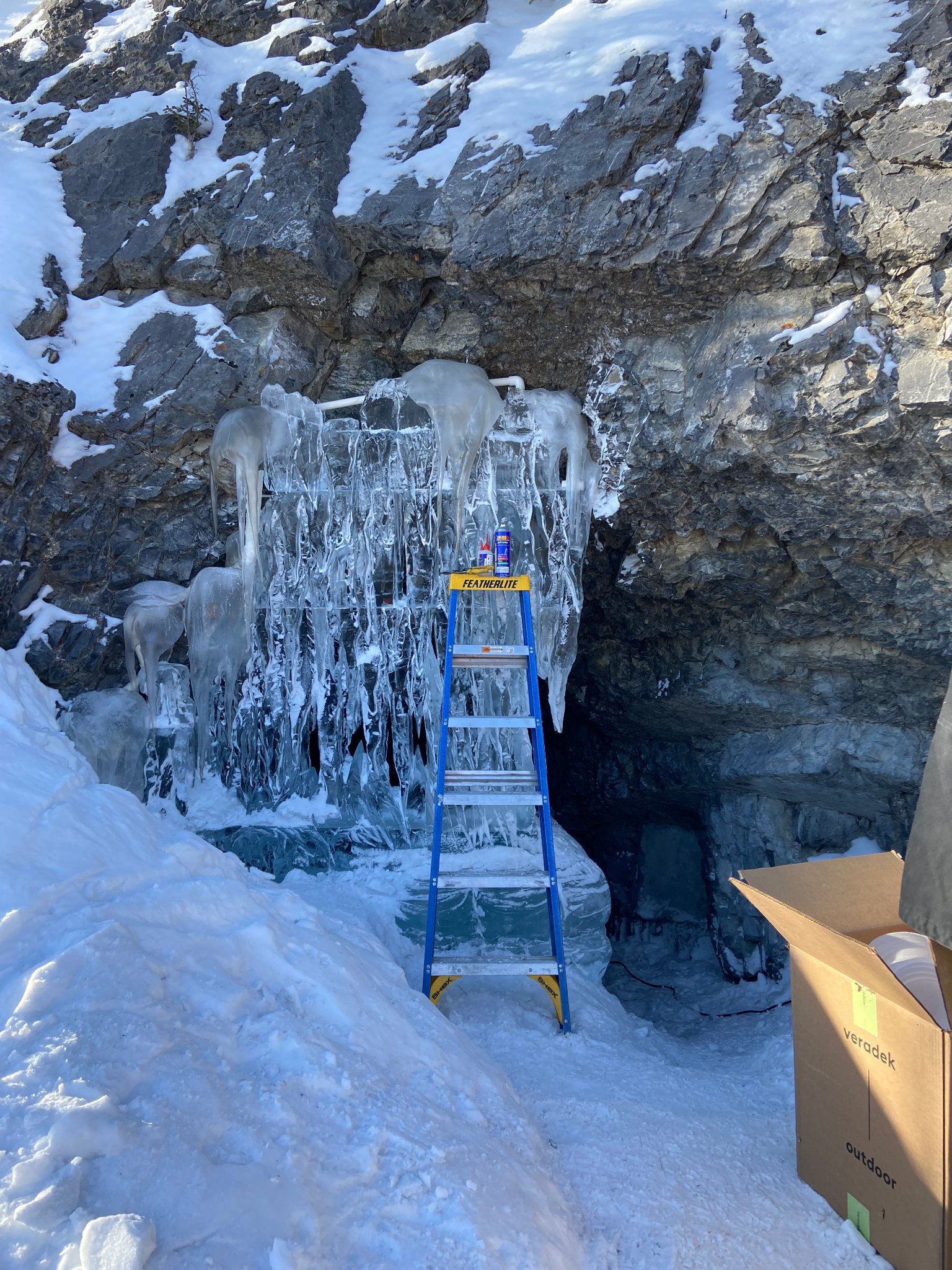 Cave entrance — ice wall almost complete with icicles forming
