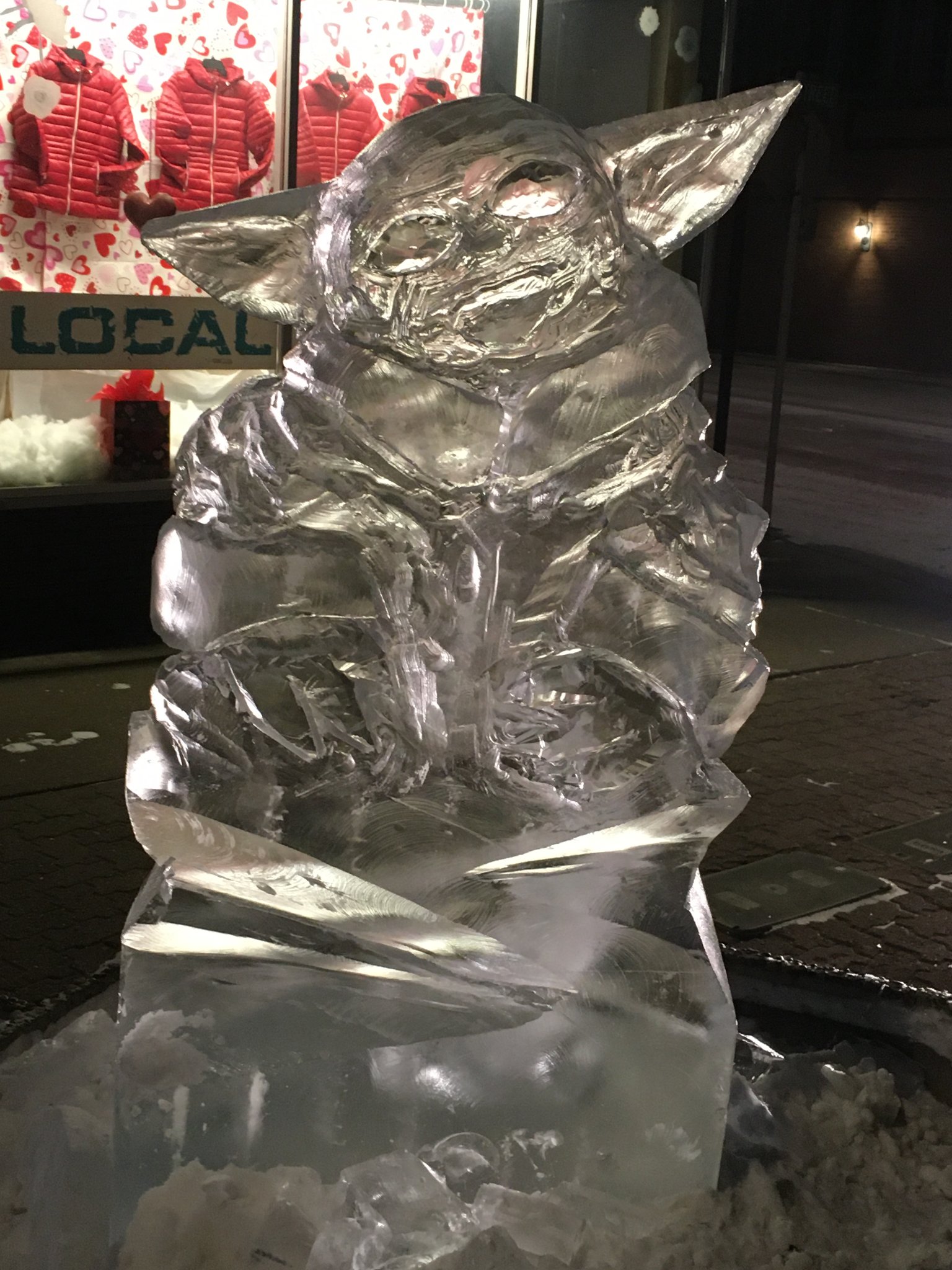 Baby Grogu ice sculpture at night