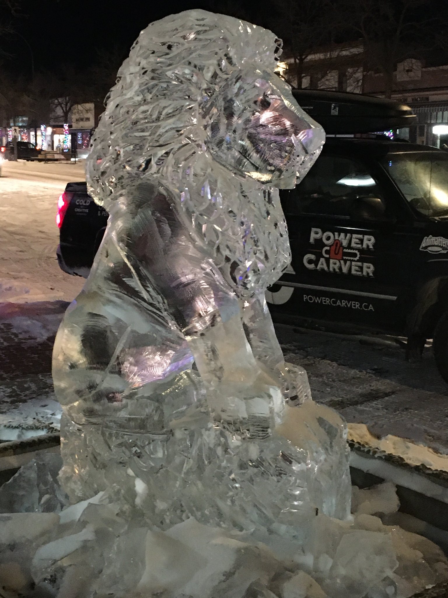 Lion ice sculpture at night