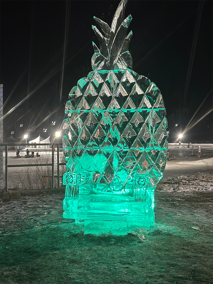 Pineapple throne ice sculpture at night