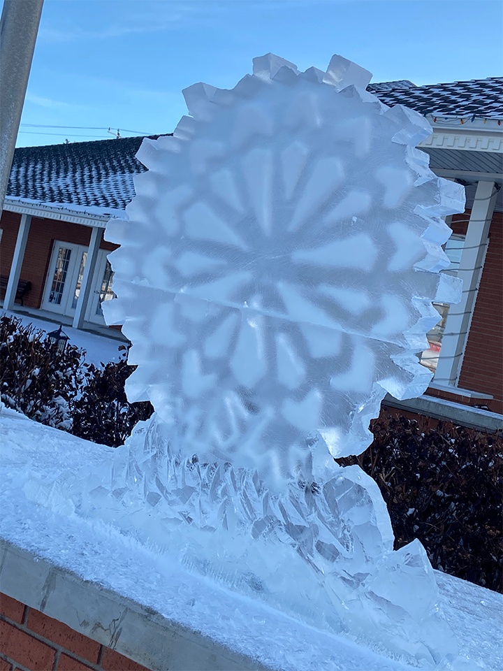 Snow filled snowflake ice sculpture